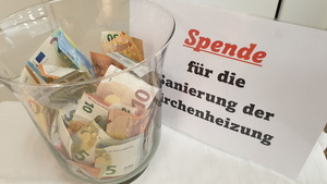 Symbolbild: Spende für die Sanierung der Kirchenheizung